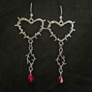 Bright silvertone "barbed wire" heart and red glass crystal drop earrings